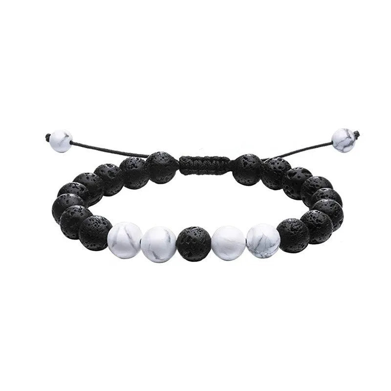 Geometric matte black agate couple bracelets with tiger eye beads, shown as a matching set.