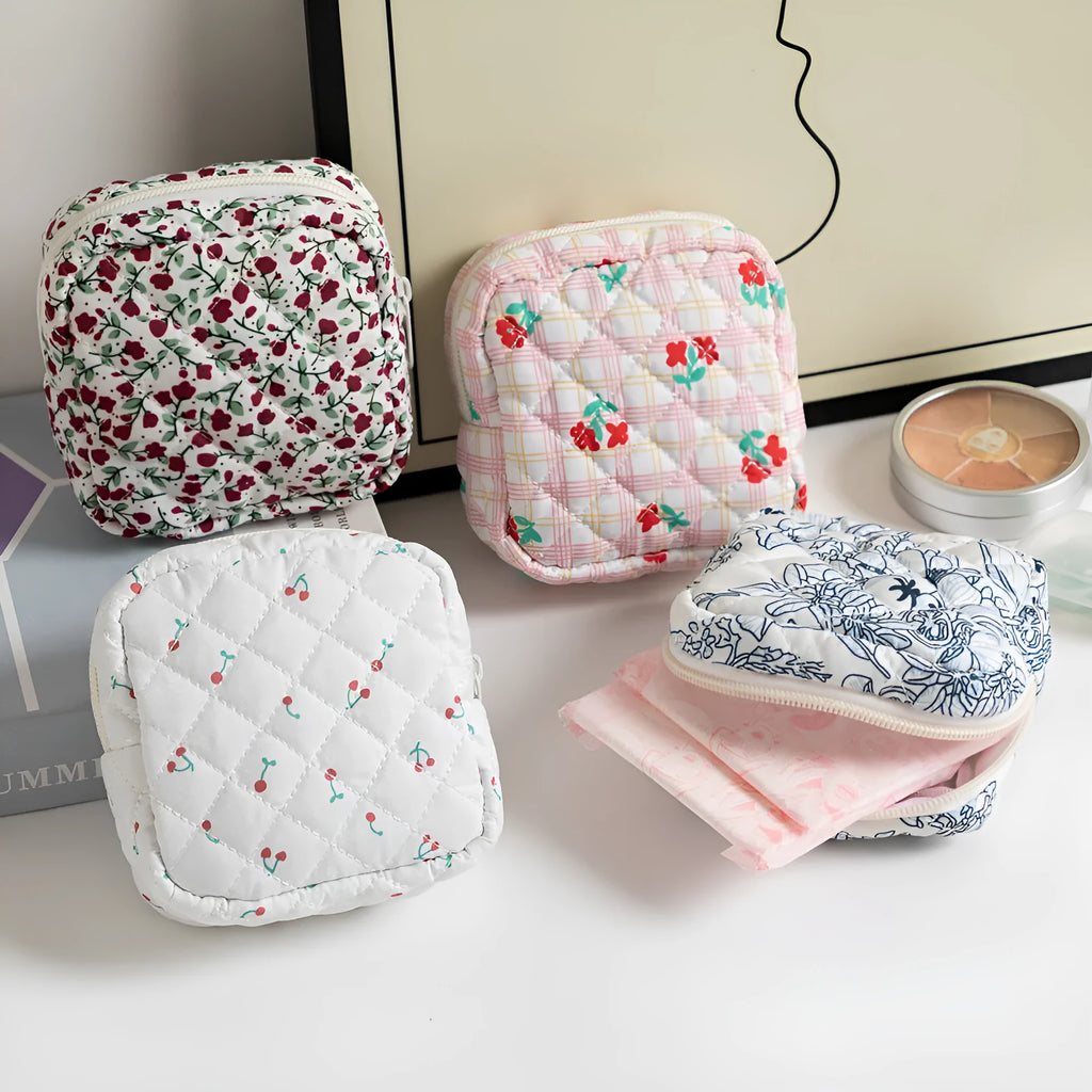 Women's key storage bag in floral polyester with sewing thread details, showing multiple colour and pattern options