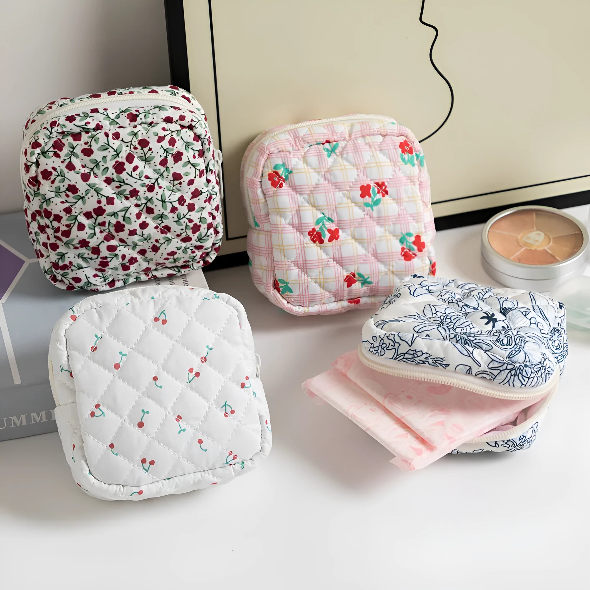 Women's key storage bag in floral polyester with sewing thread details, showing multiple colour and pattern options