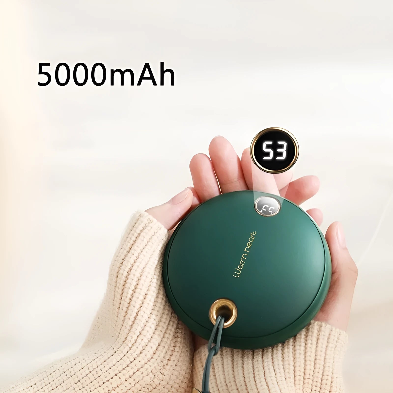 Green hand warmer power bank with digital display showing battery percentage and temperature setting