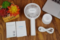White ORICO FH1 portable USB desk fan with fine line design on a desktop.