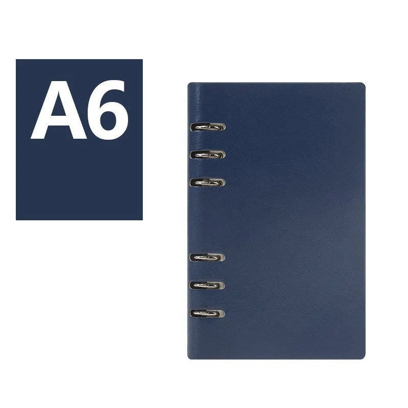 Loose-leaf business notebook with imitation leather cover in multiple colours, open to show beige paper.