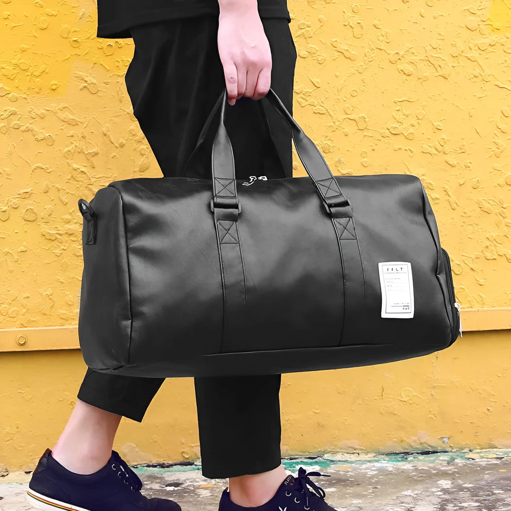 Black waterproof sports fitness bag with separate shoe compartments and diagonal carry straps.