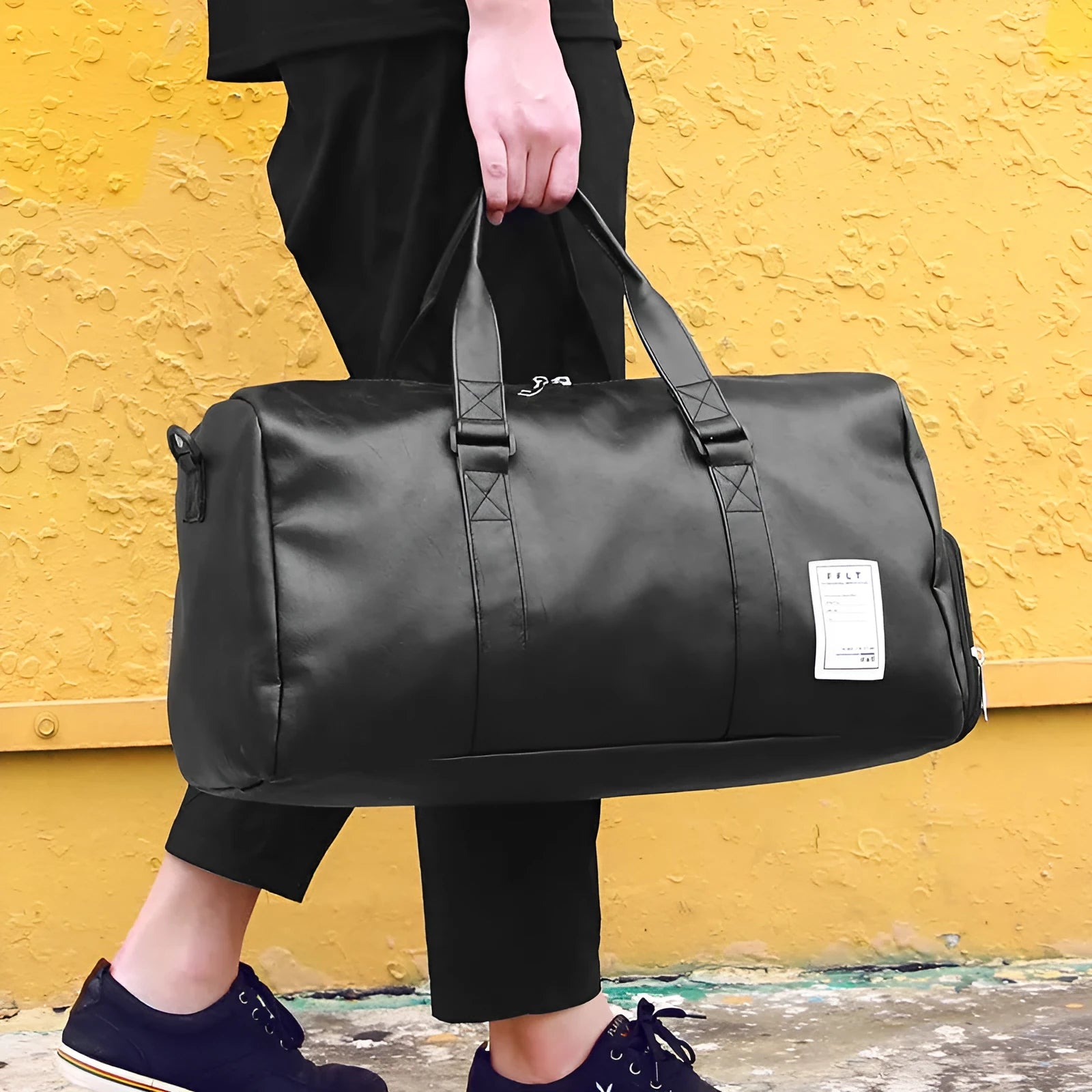 Black waterproof sports fitness bag with separate shoe compartments and diagonal carry straps.