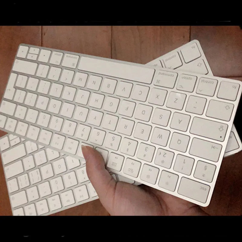 Apple white metal Bluetooth wireless keyboard with ultra-thin design and multimedia keys
