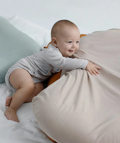 Beige portable cotton baby nest crib cushion measuring 75cm by 45cm for infant sleep.