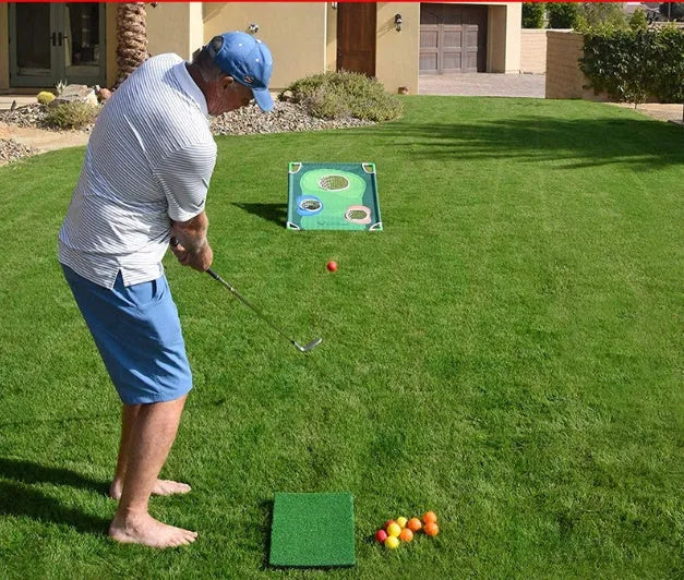 Green 90x60cm golf swing practice net with PVC frame and oxford cloth cover on grass, with straw mat and balls