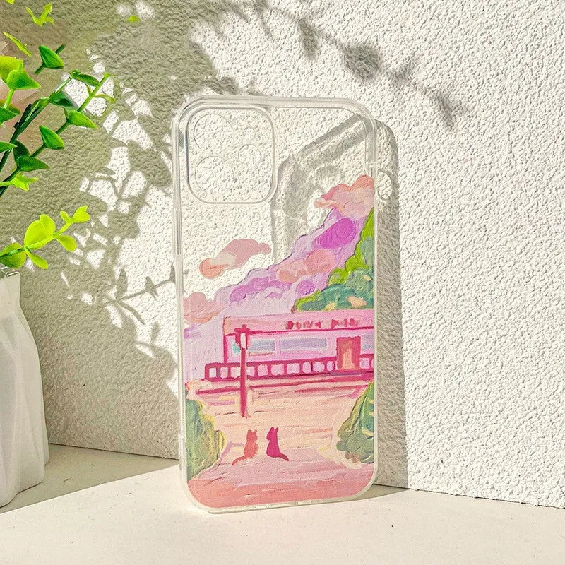 iPhone hard case with a cartoon graphic of two cats printed on the back.