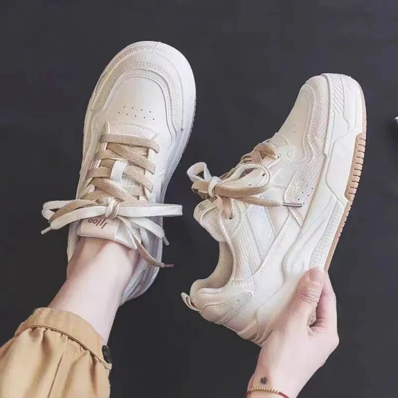 Women's beige and pink low-top rubber sneakers with height-increasing sole on a white background