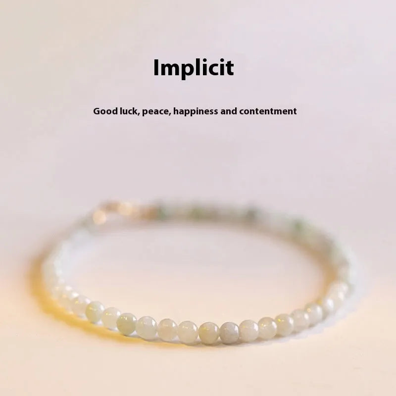 Women's Korean style retro jade bracelet in ball type design on a wrist.