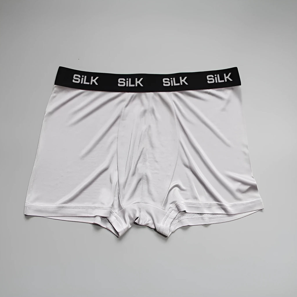 Men's loose fit silk shorts in navy blue, silver grey, and skin colour options