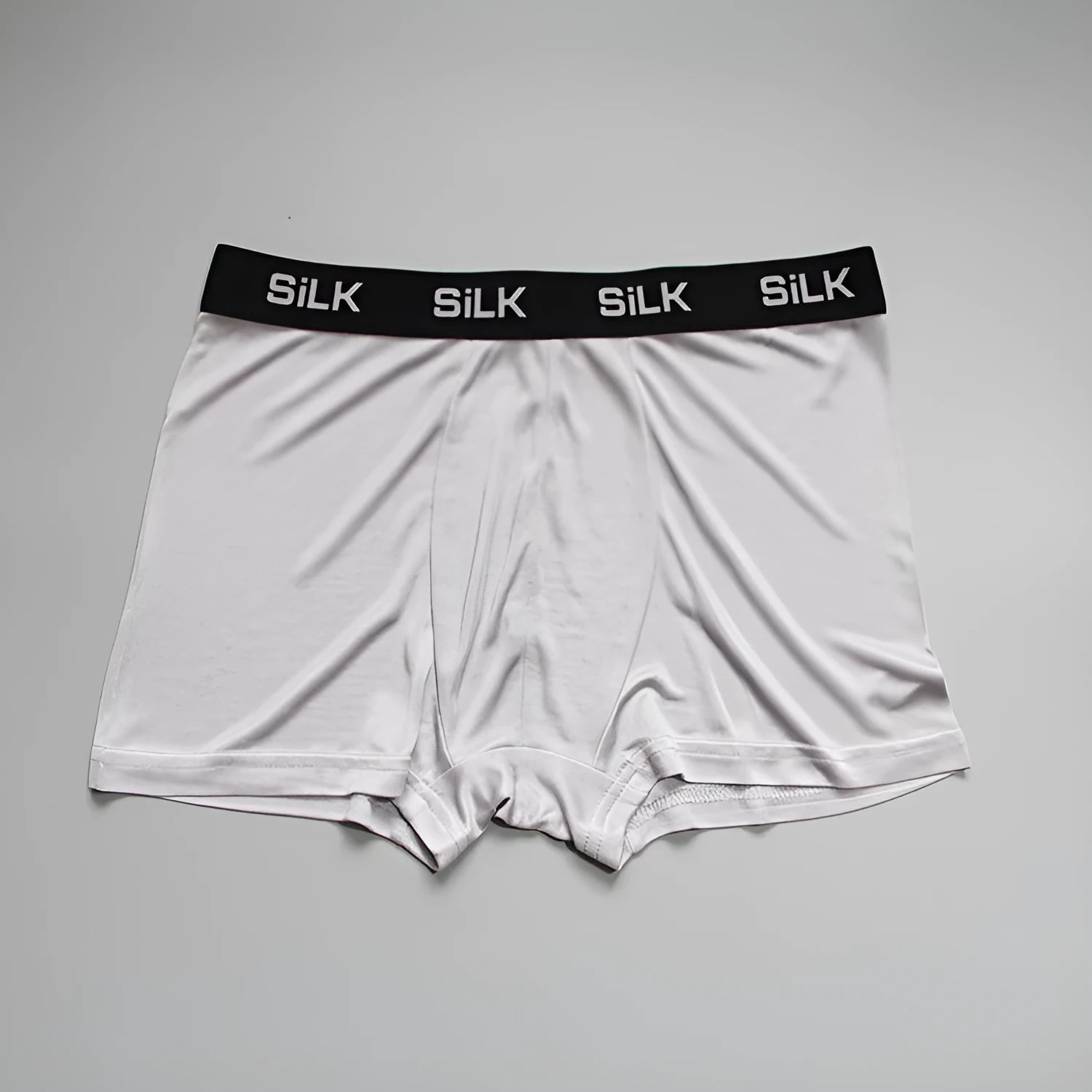 Men's loose fit silk shorts in navy blue, silver grey, and skin colour options