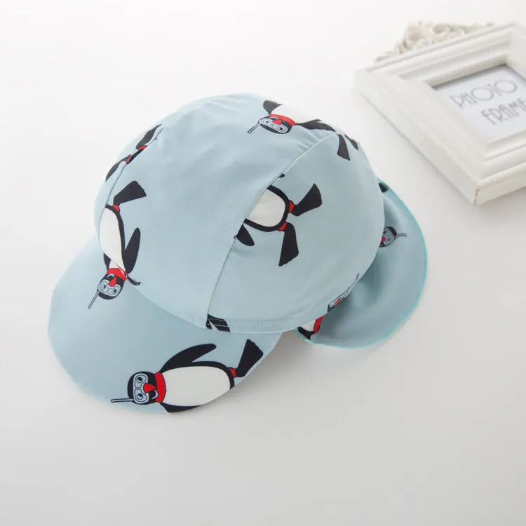 Boys penguin design swimwear set with long sleeves and matching swimming cap