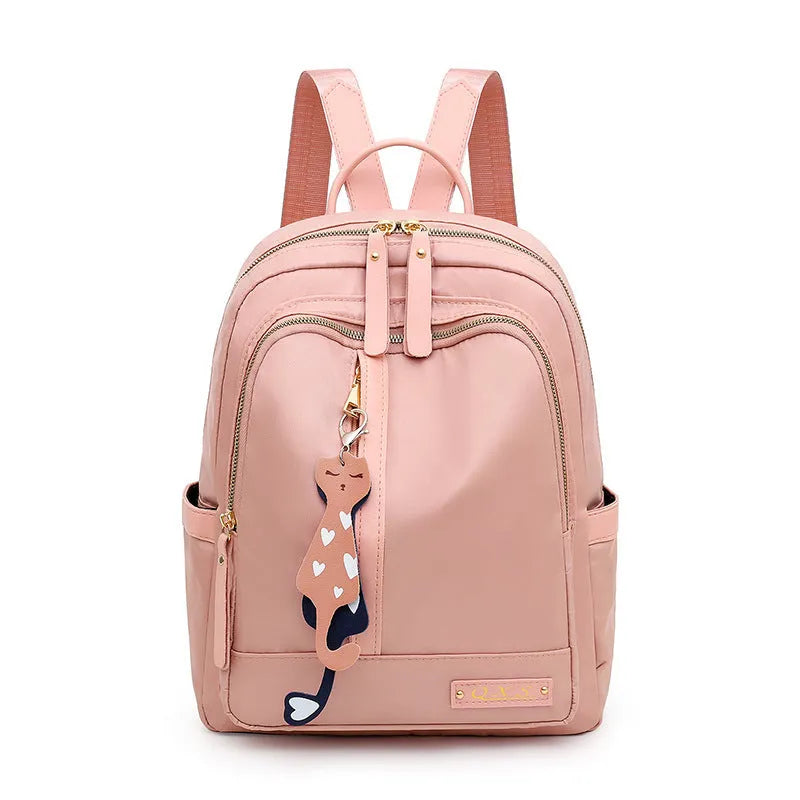 Women's black nylon backpack with double shoulder straps and organisational compartments