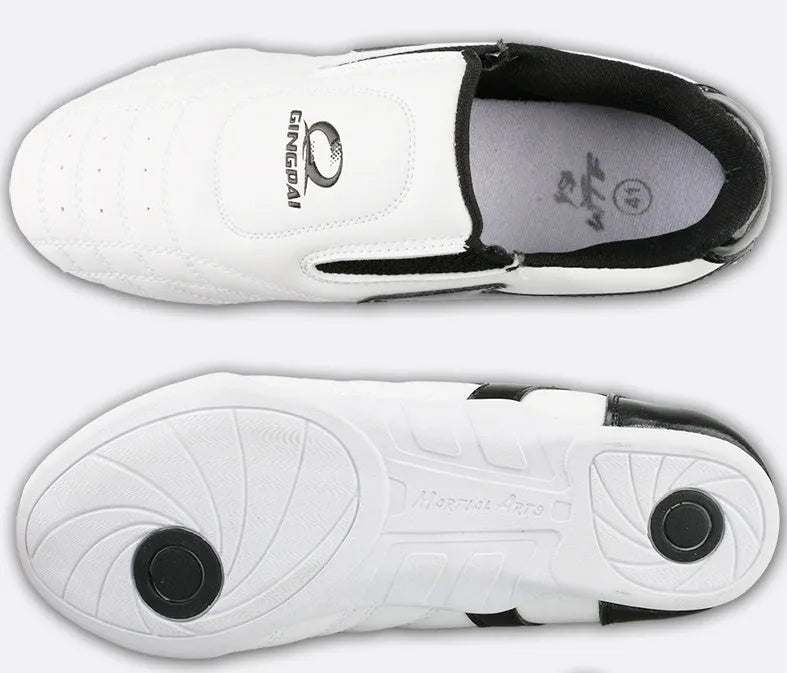 Black and white children's martial arts training shoes with a soft sole and widened design.