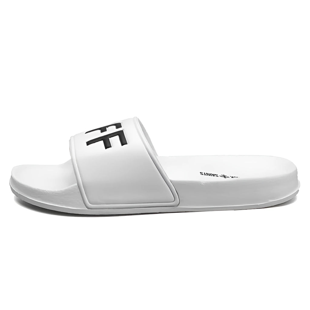 Men's black and white open-toe slippers with a textured rubber sole on a plain background