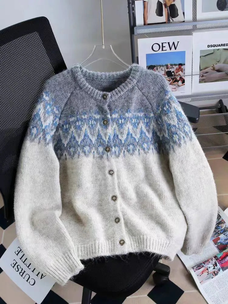 Women's beige jacquard knit sweater coat with contrast pattern, shown with long sleeves and a loose fit.