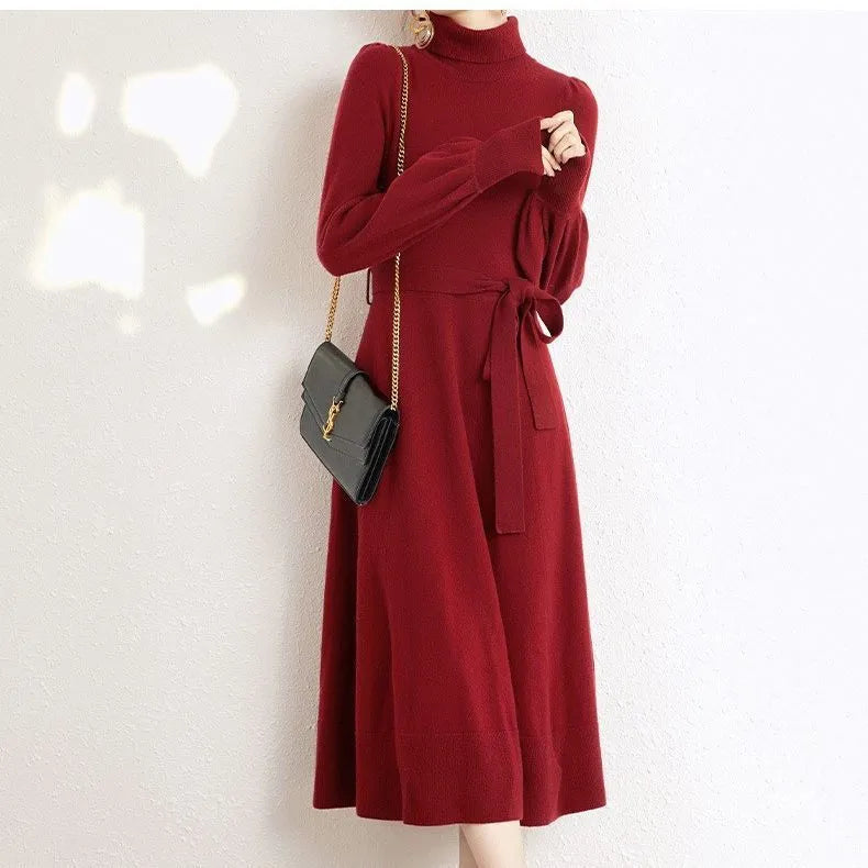 Turtleneck knitwear dress in polyester fabric with elastic waist and loose hem in solid colour