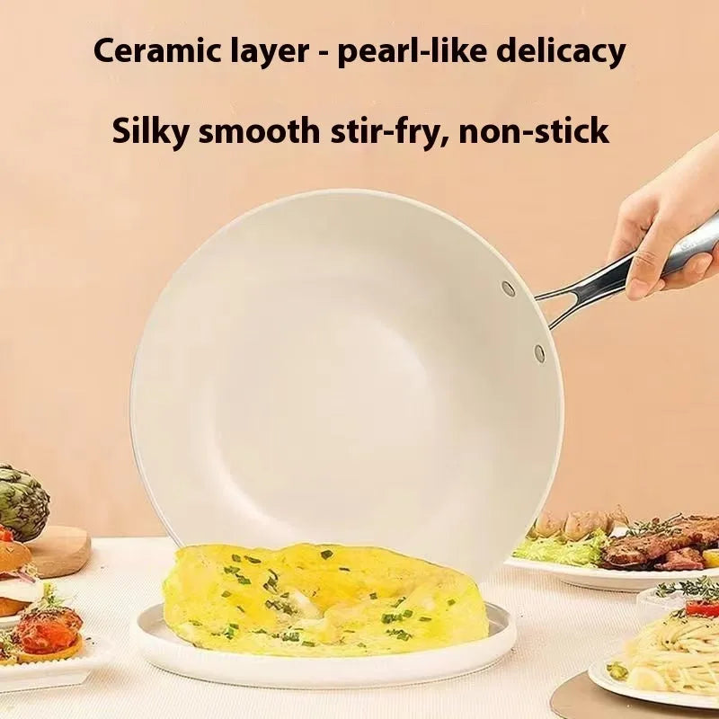 28cm pebble ceramic non-stick stir fry pan with refined iron body and stainless steel glass lid on a kitchen counter