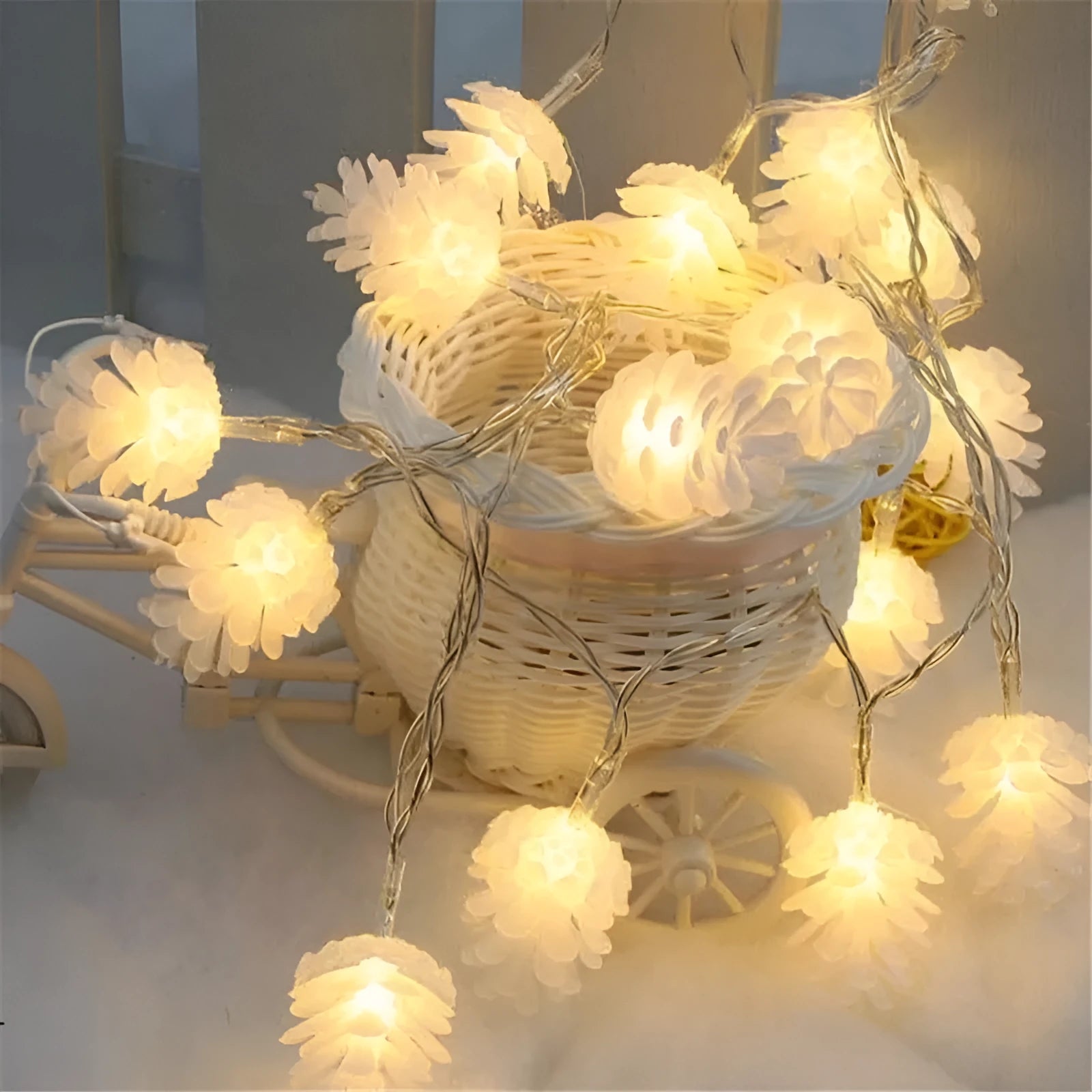 Warm white LED pine cone battery-powered string light draped decoratively