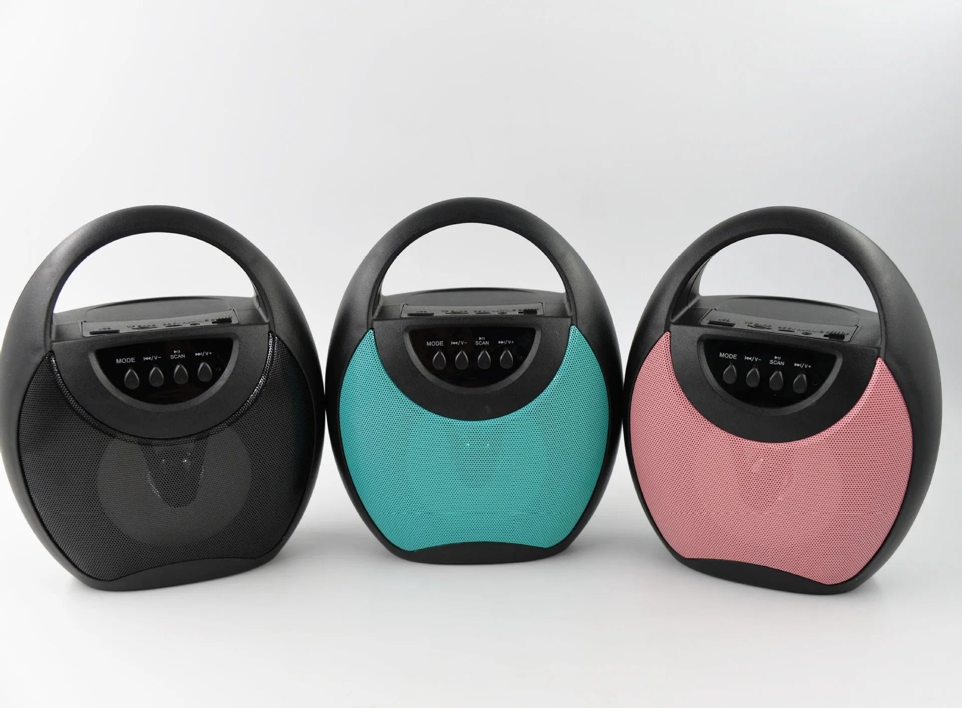 Portable Bluetooth speaker with plastic housing in black, blue, or pink colour options