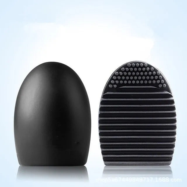 Silicone makeup brush wash egg in blue with top knobs and bottom grooves for cleaning bristles