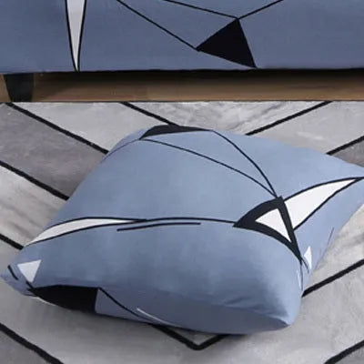Geometric patterned stretch sofa slipcover fitted on a modern two-seater sofa.