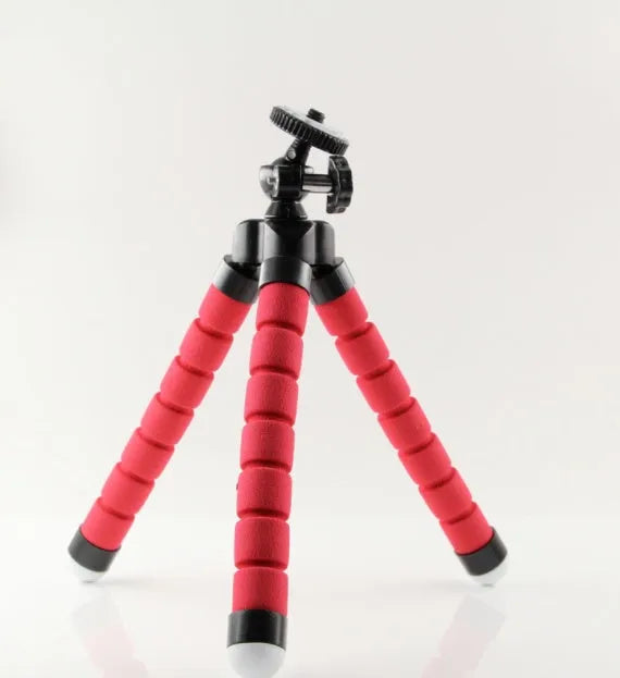 Black flexible octopus tripod with bent legs wrapped around a pole, showing smartphone mount with 1/4-20 screw.
