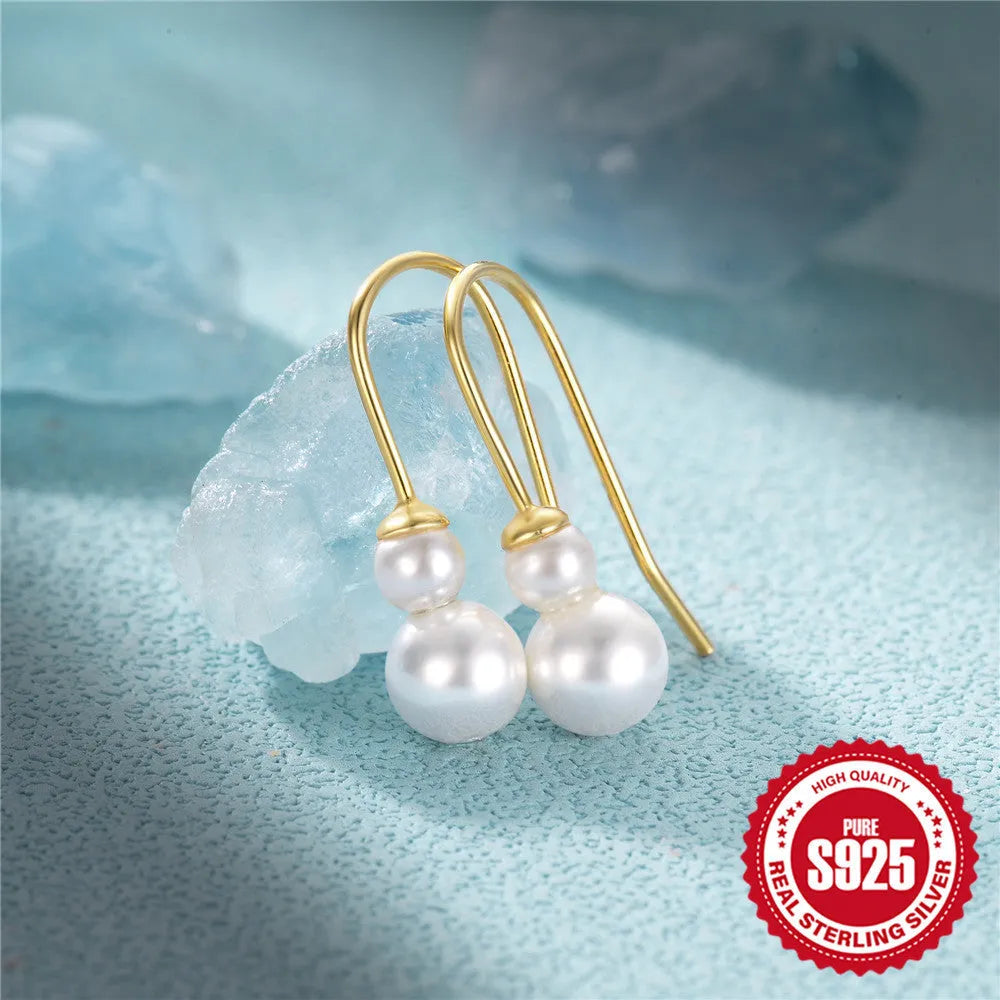 Pair of S925 sterling silver earrings with a sunflower geometric design and golden three diamonds.