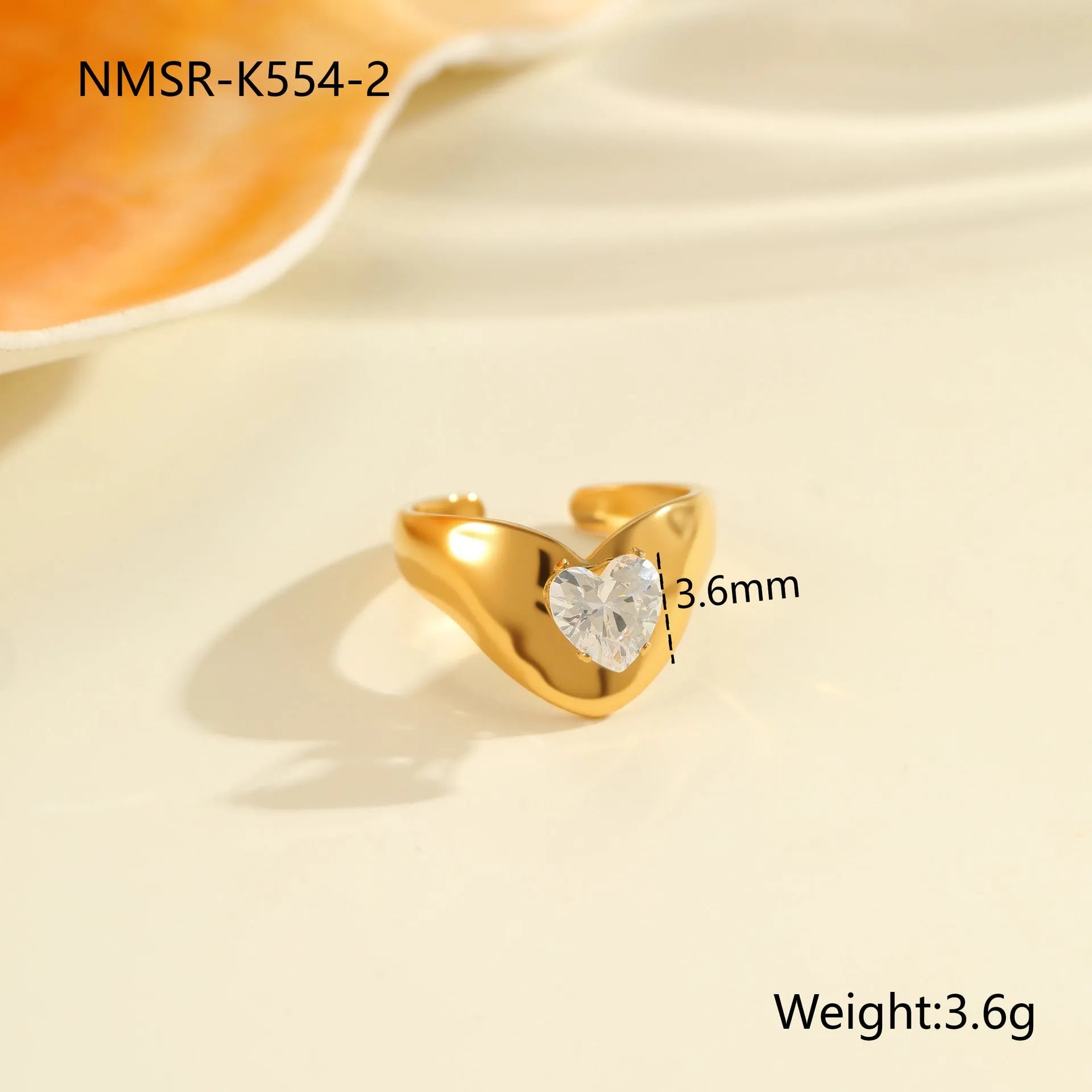 Geometric open mouth stainless steel zircon ring in a free size on a hand.