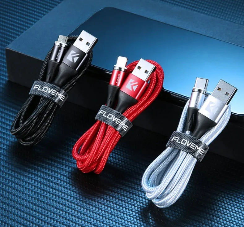 Black magnetic USB charging cable with illuminated side light on connector, next to smartphone.