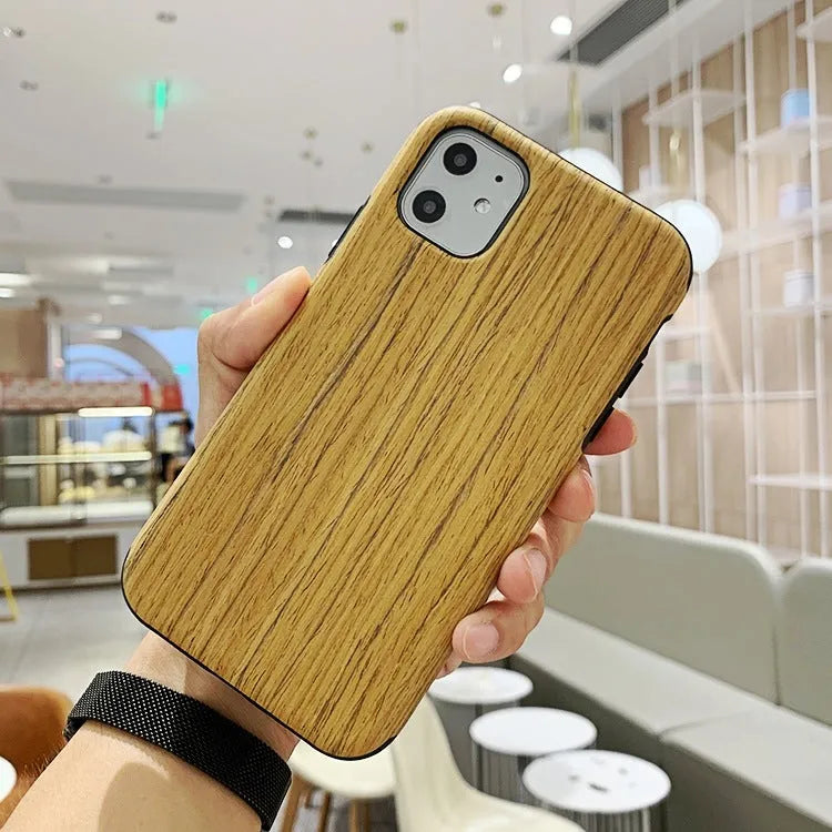 Wooden iPhone case with natural wood grain showing rosewood finish on iPhone 11 Pro
