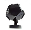 LED starry sky projector night light showing constellation projection on a bedroom ceiling.