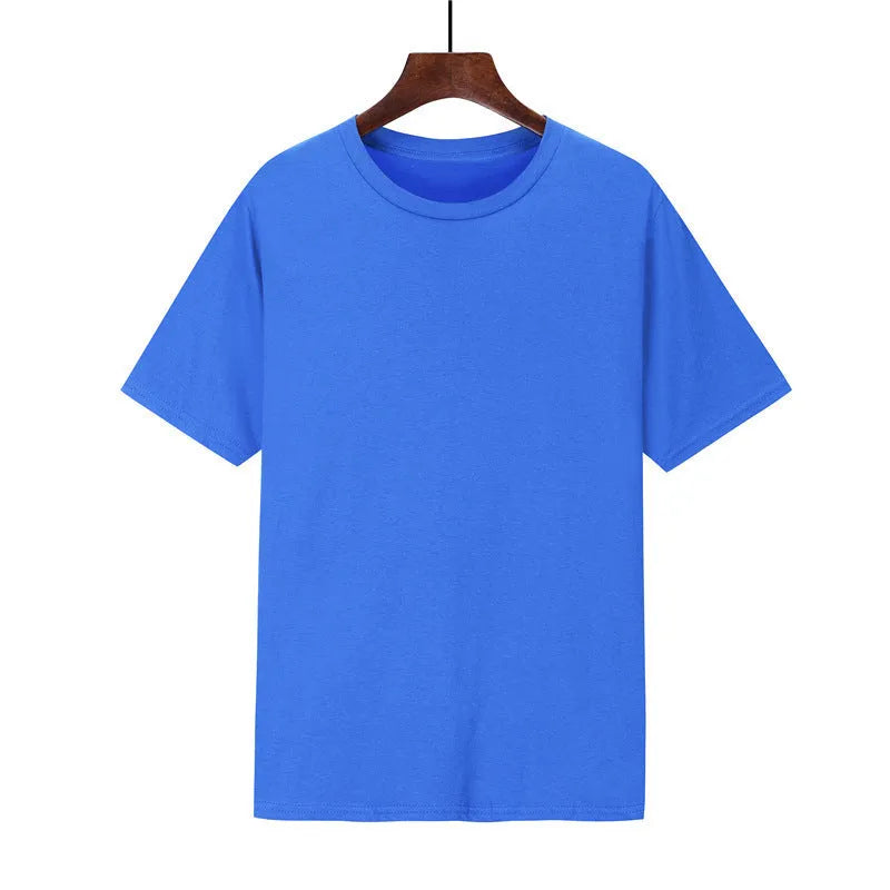 Man wearing a black loose-fit cotton T-shirt with short sleeves, showcasing casual style.