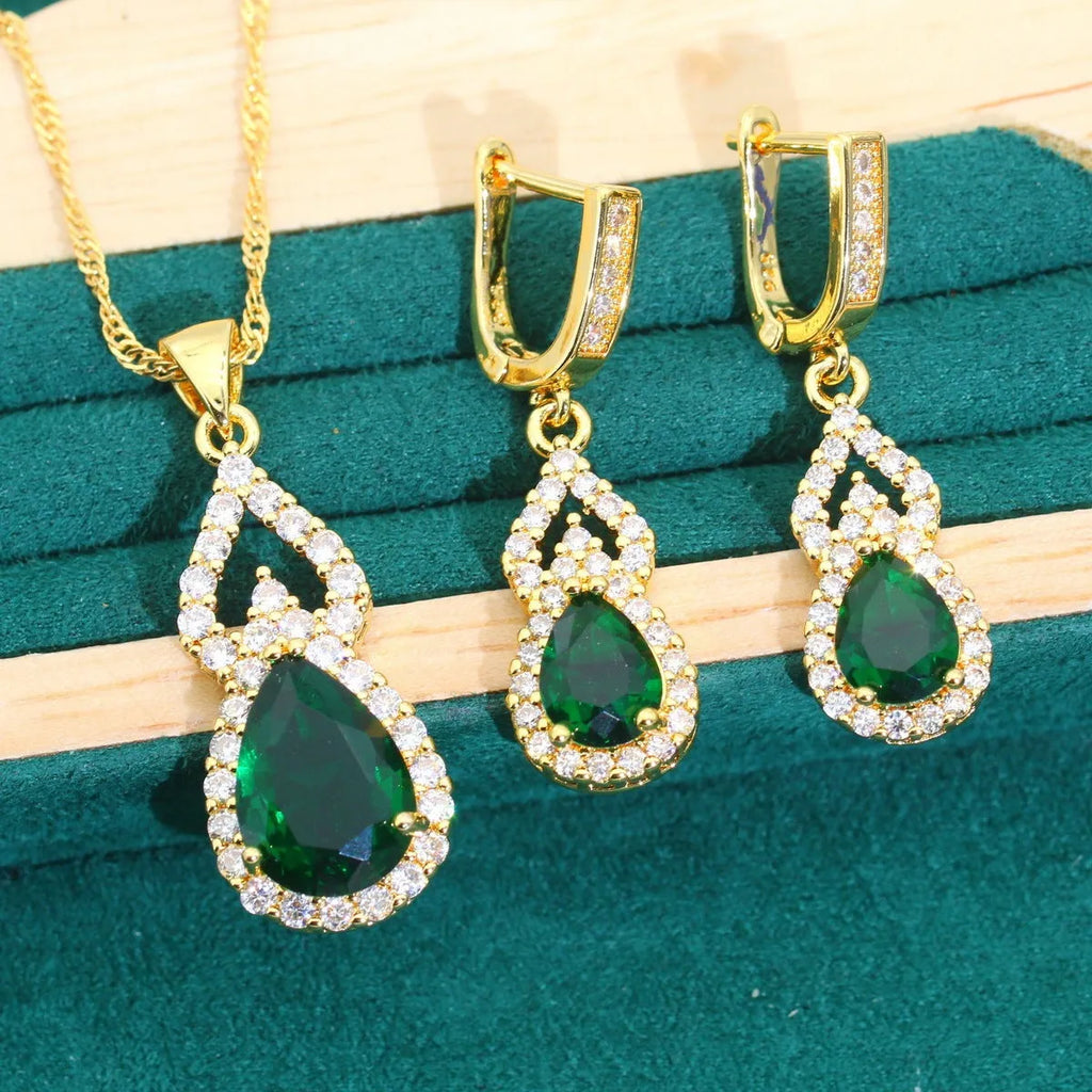 High-end bridal jewelry set with copper inlaid zircon cross and crown pendants in electroplated green and red finish on water wave chain