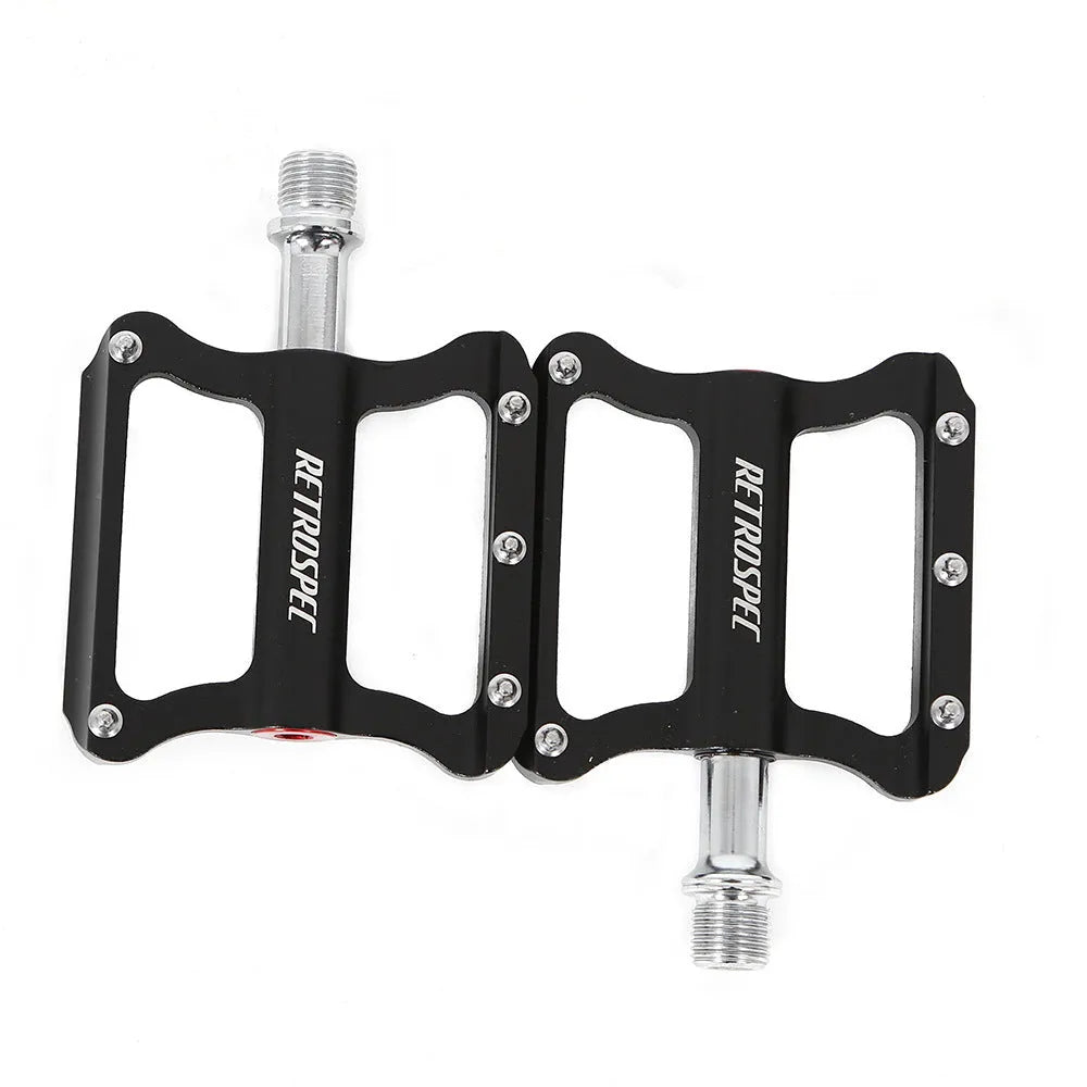 Pair of black aluminium CNC machined mountain bike pedals with anti-skid nails sealed bearing