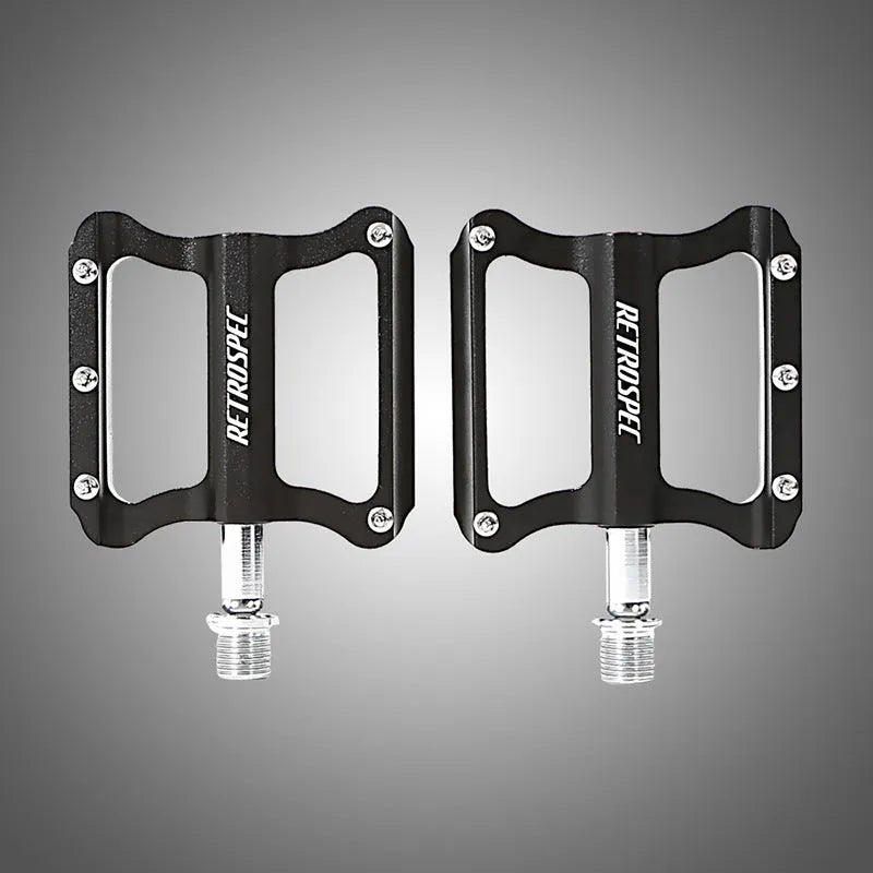Pair of black aluminium CNC machined mountain bike pedals with anti-skid nails sealed bearing