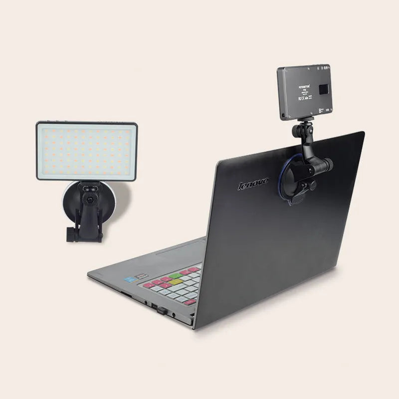 Black aluminium LED video conference light panel with 96 LEDs, shown next to a laptop.