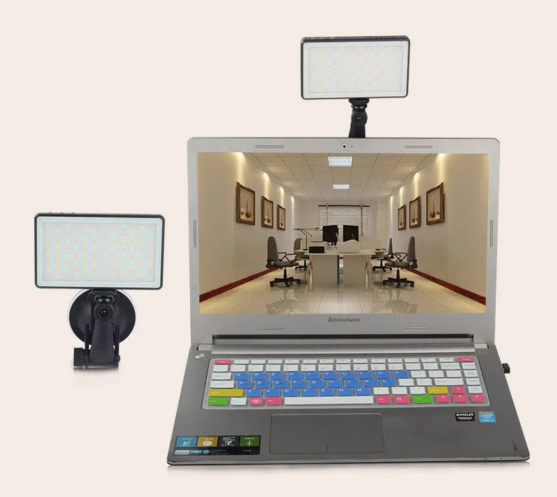 Black aluminium LED video conference light panel with 96 LEDs, shown next to a laptop.
