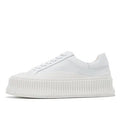 Women's black thick sole platform sneakers with back lacing system and suede leather construction