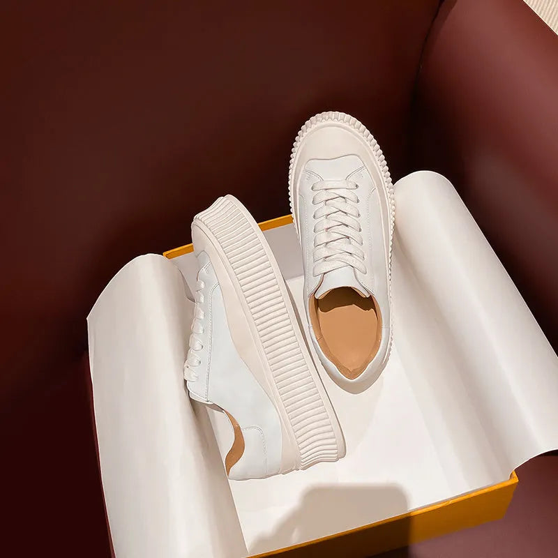 Women's black thick sole platform sneakers with back lacing system and suede leather construction