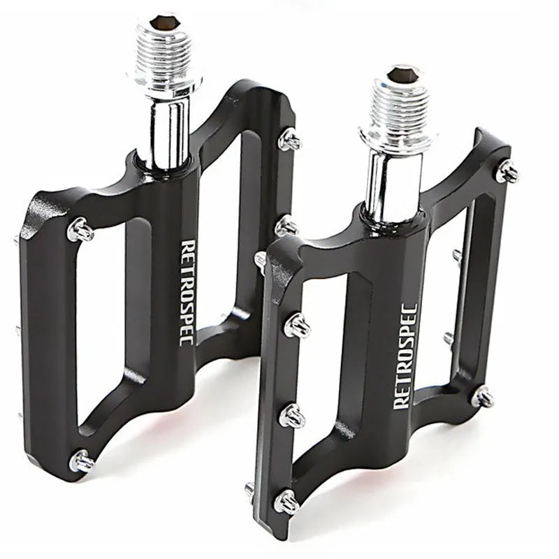 Pair of black aluminium CNC machined mountain bike pedals with anti-skid nails sealed bearing