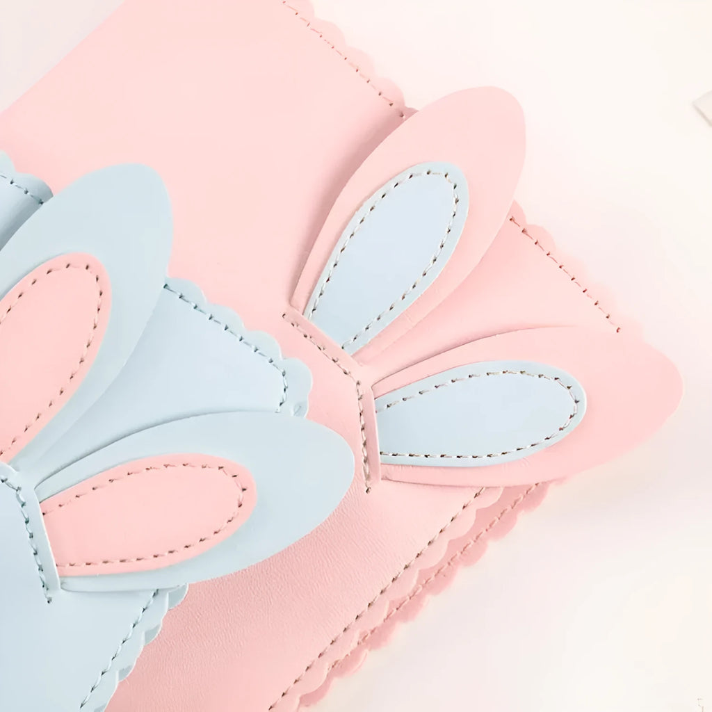 Cute bunny style mini photo album in pink, blue, or white, showing compact size and loose-leaf pages.