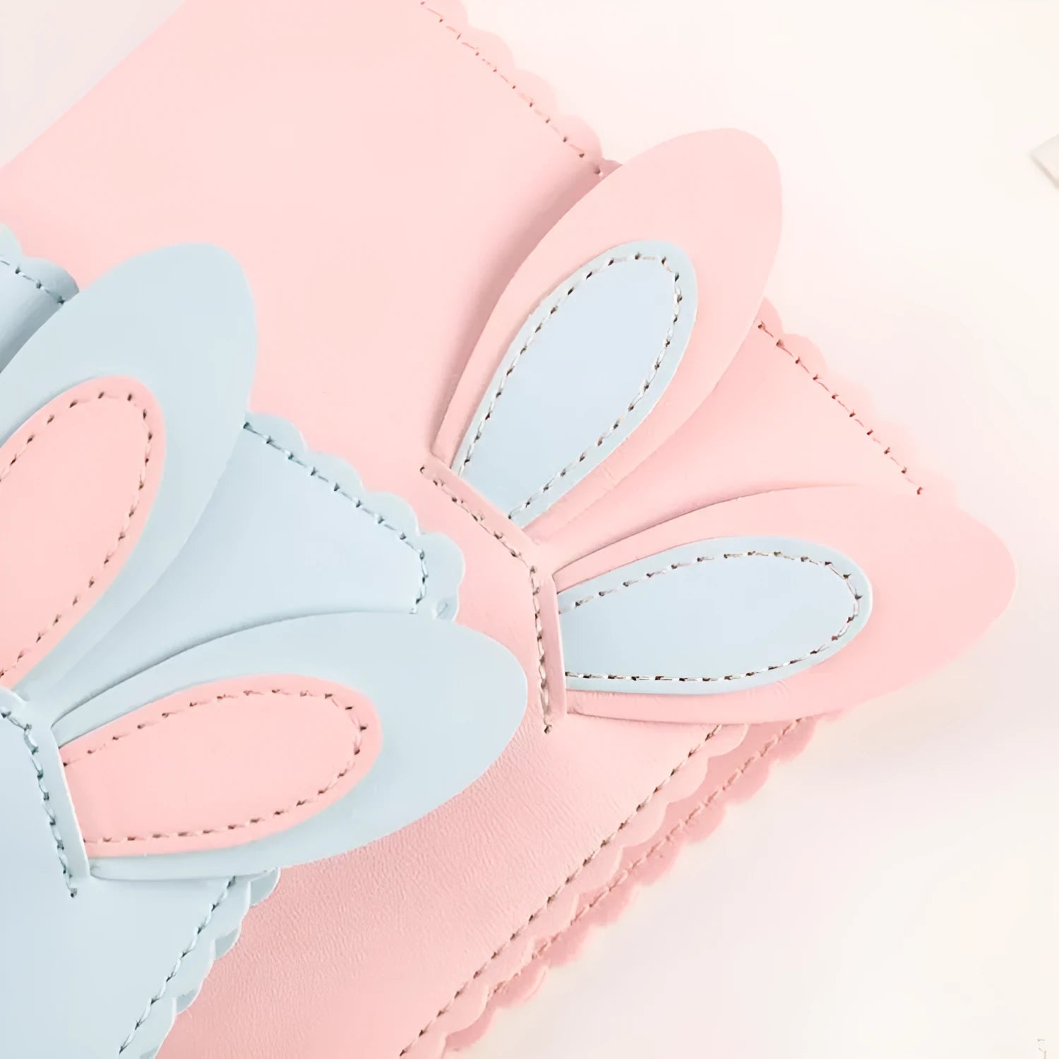 Cute bunny style mini photo album in pink, blue, or white, showing compact size and loose-leaf pages.