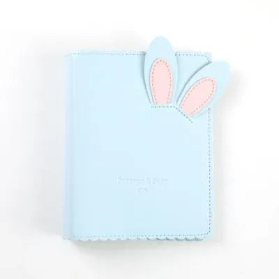 Cute bunny style mini photo album in pink, blue, or white, showing compact size and loose-leaf pages.