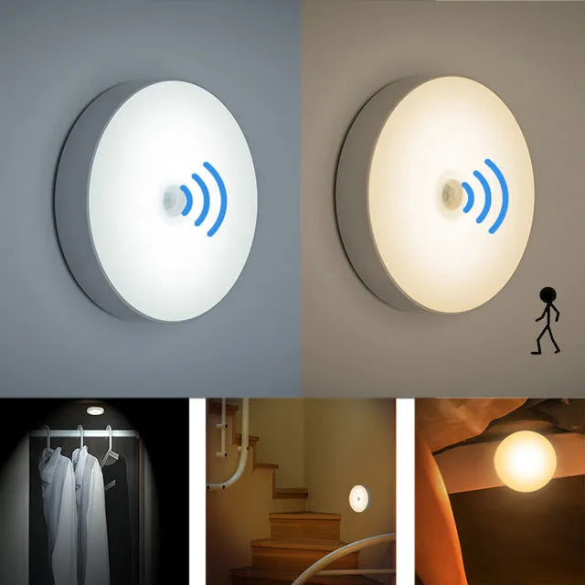 Small white circular motion sensing LED night light with adhesive backing next to a USB charging cable.