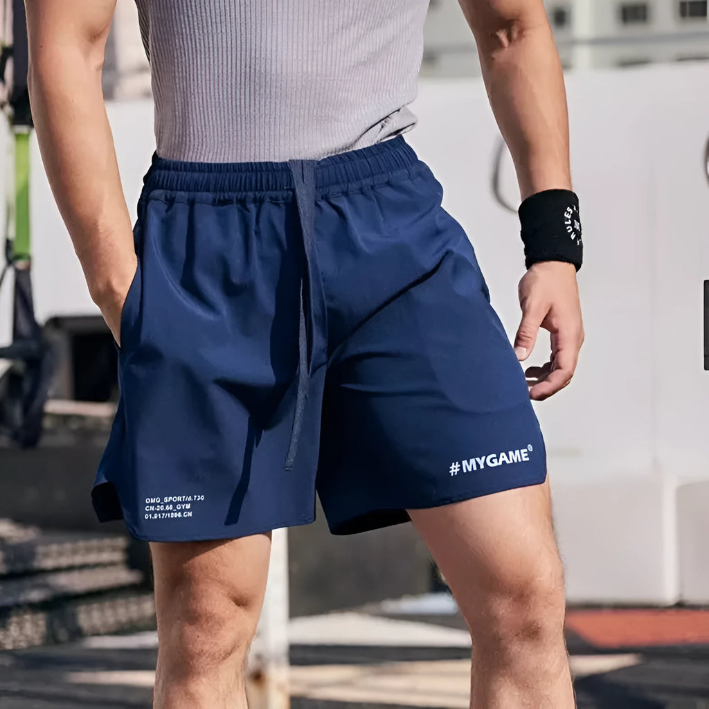 Men's grey quick-dry fitness training shorts made from polyester and spandex fabric.