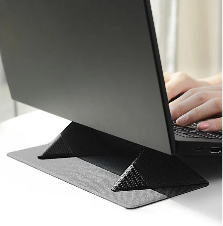 Portable non-slip cooling bracket for laptop with ergonomic design in blue, folded with built-in magnet