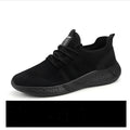 Men's black and white mesh sneakers with round toe and PVC sole for casual sport wear