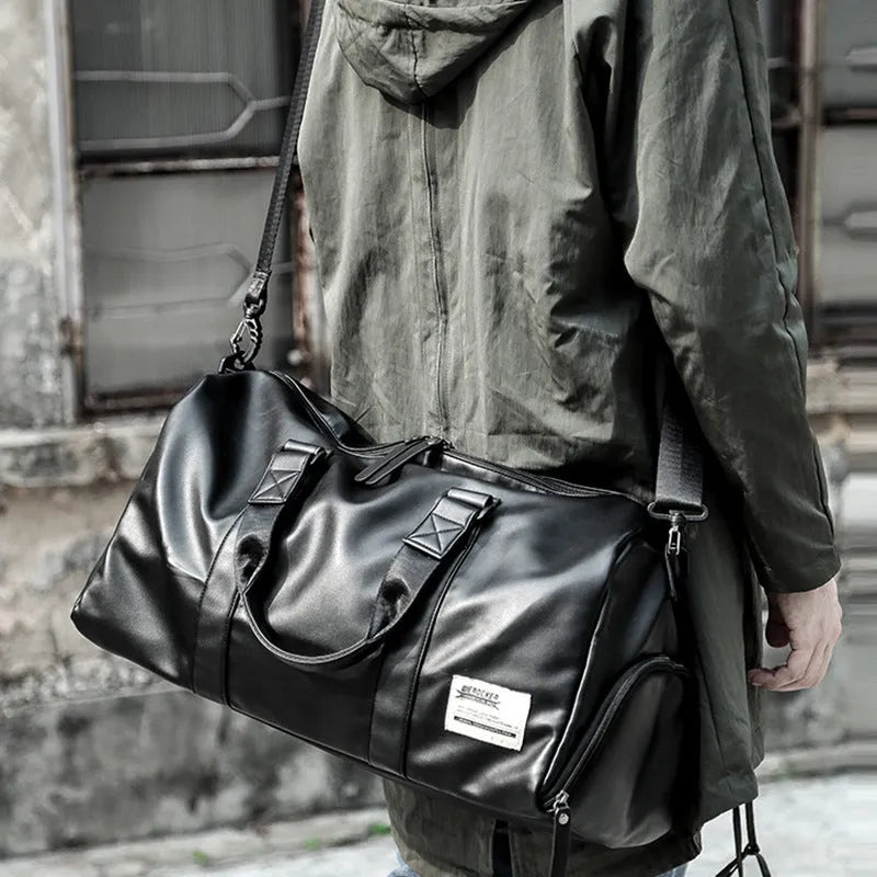 Large black waterproof PU leather sports training bag with multiple internal compartments.